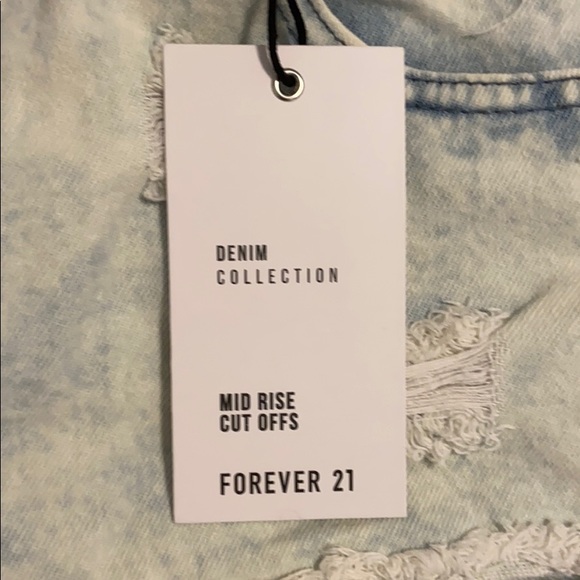 Light Denim Distressed Mid Rise Jean shorts - Picture 2 of 6